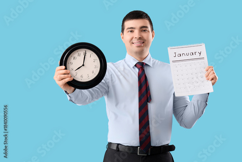 Young businessman with cloc...
