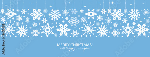 Christmas greeting card from white snowflakes on blue background