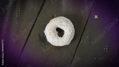 Purple cueing dots and crosses pulsing, fading around center frosted donut, evoking retro look
