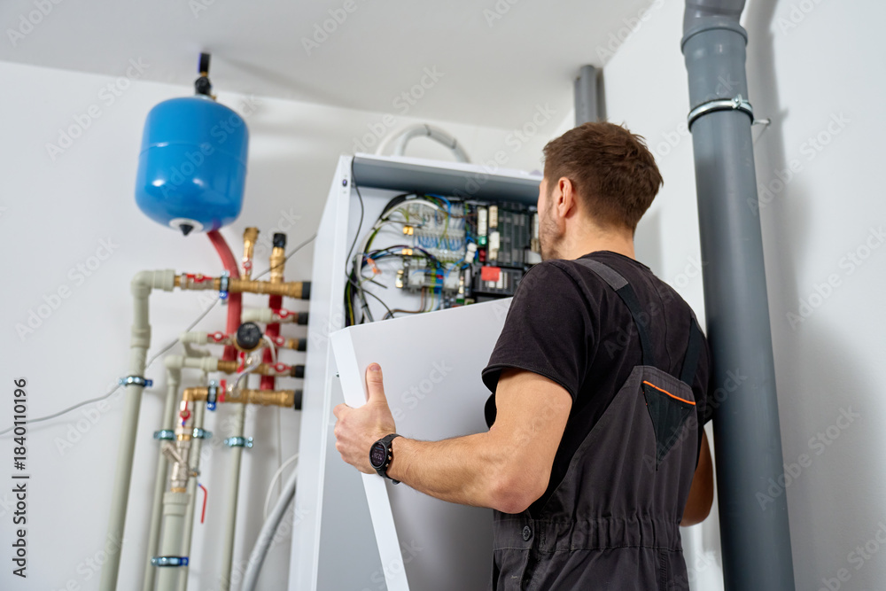 custom made wallpaper toronto digitalTechnician open control panel with internal wiring to inspecting heat pump unit. Specialist servicing heating and cooling system. Concept of HVAC maintenance, home heating system and energy efficiency