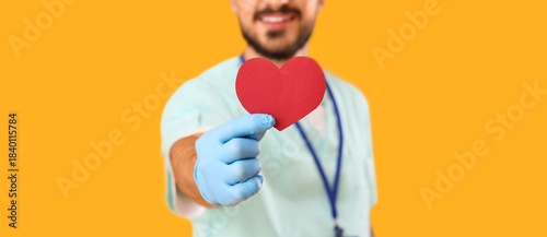 Male doctor with paper hear...