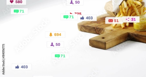 Badges appearing, floating and clustering to burger and fries on board, showing social engagement