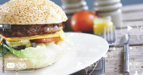 Sesame-seed burger left on plate, bubbles popping at frame-two, camera sliding right tracking likes