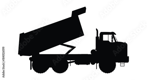 A striking black silhouette of a heavy duty dump truck with an elevated bed silhouette