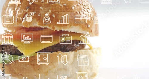 Camera panning, sesame burger sliding right while white finance icons appearing and showing finance
