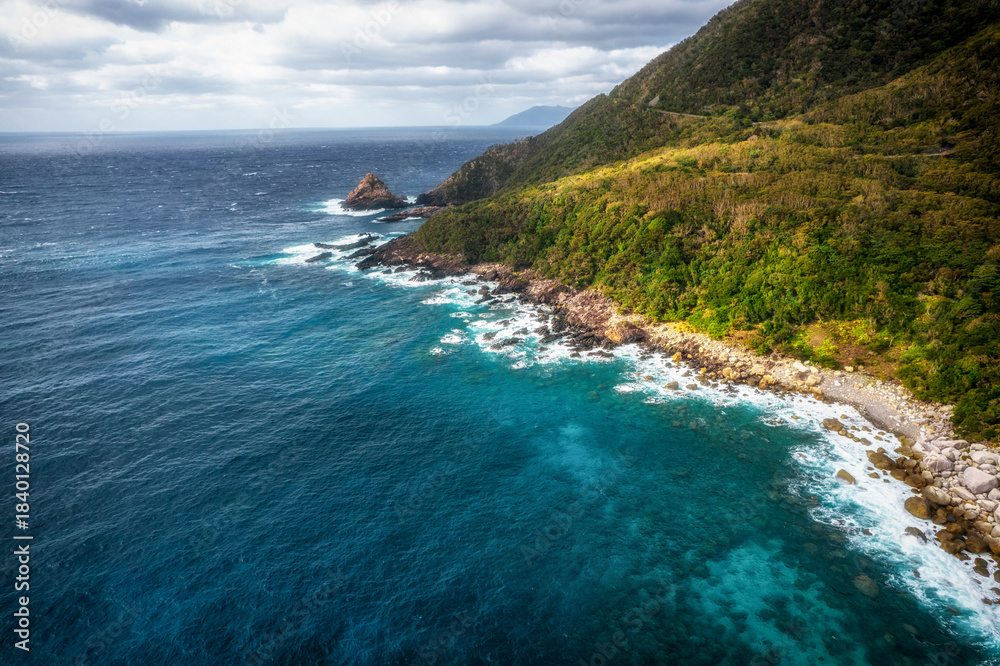 Fototapeta premium Aerial view of the western forest road of Yakushima, a World Heritage Site, Kagoshima Prefecture, Japan.