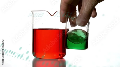 Upper right hand entering, causing beaker tilting, green sloshing beside red beaker for demo