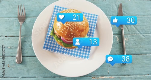 First blue bubble appearing, blue bubbles multiplying beside sesame burger, showing rising likes