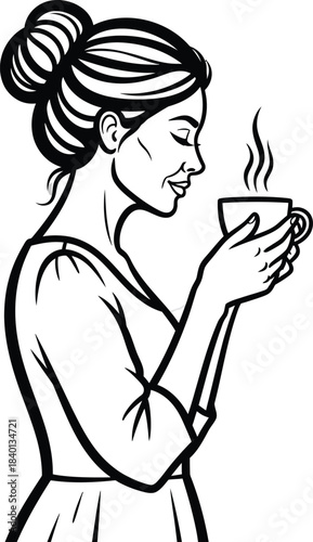 Serene woman with a bun hairstyle in profile holding a steaming cup of coffee.