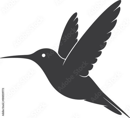 Elegant black silhouette of a hummingbird in dynamic mid flight pose
