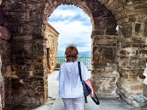 Exploring ancient ruins while admiring stunning views from the historic site in a serene landscape