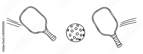 Pair of pickleball paddles and ball symbolizing game play and active leisure for sports enthusiasts and outdoor activities promotion.