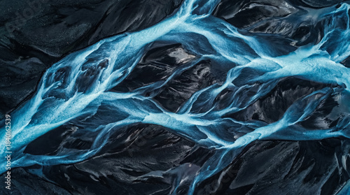 Abstract aerial pattern of braided glacial river channels in electric blue over dark volcanic sand, natural texture background and Earth science concept, generative AI