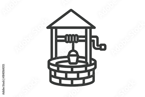 Traditional water well structure featuring a protective roof and a bucket suspended by a rope