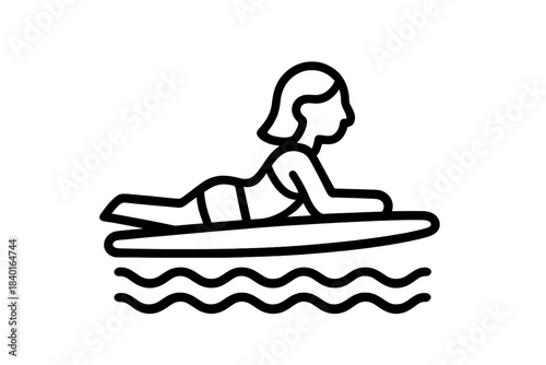 Woman paddling a long surfboard across the water during summer activity