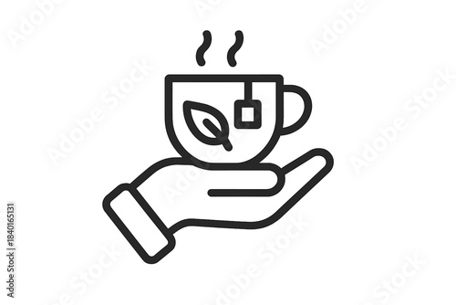 Hand holding a steaming cup of hot herbal tea with a prominent leaf and teabag element