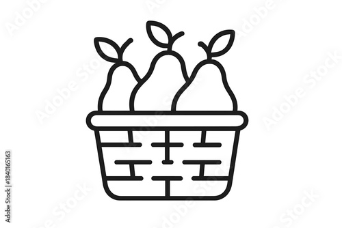 Three ripe pears with stems and leaves placed inside a small woven harvest basket