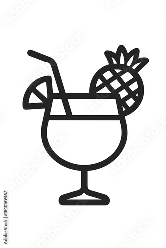 Tropical cocktail drink with pineapple and citrus slice garnish in stemmed glass