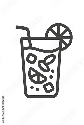 Refreshing summer beverage in a tall glass with ice cubes, citrus slice, and drinking straw