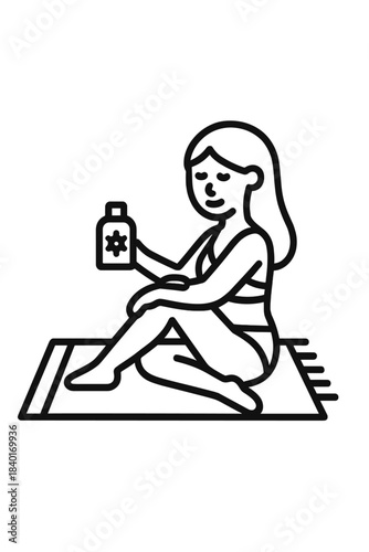 Woman sitting on a mat applying sunscreen lotion to her leg while sunbathing