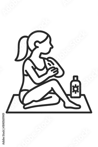 Young woman applying protective sunscreen lotion to her arm while sitting and sunbathing