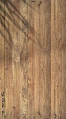 Vertical clip of shadow of palm leaf moving gently in wind on wood slats, summer wooden background, backdrop