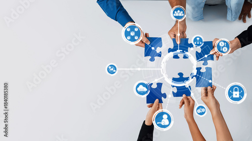 Valokuva This image captures collaborative efforts in a business setting, showcasing hands connecting puzzle pieces symbolizing teamwork, strategy, and innovative solutions for success