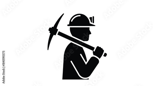 A miner with a pickaxe over their shoulder a striking silhouette