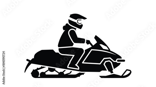 A rider on a snowmobile in dynamic motion a striking silhouette