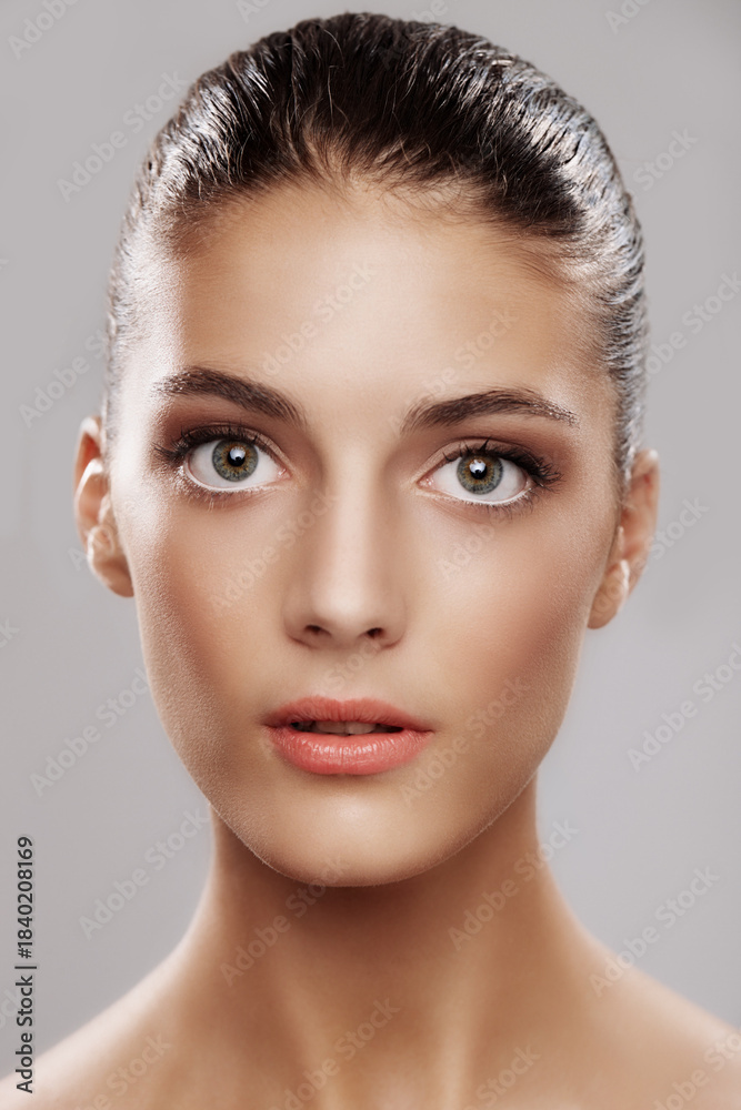 Fototapeta premium Portrait, skincare and woman in studio, makeup and beauty on white background. Glow, pride and person with cosmetics, confidence or foundation with wellness, healthy skin and aesthetic with collagen