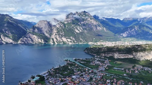 Drone shot revealing the beautiful scenery of Riva del Garda in Italy.