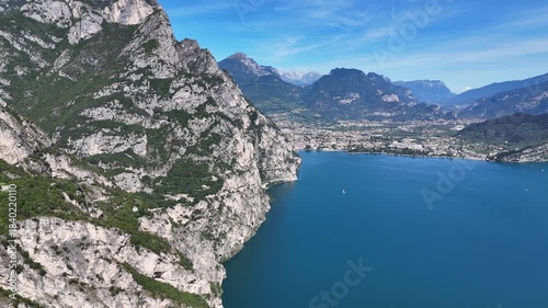 Drone shot of mountains surrounding riva del garda in Italy