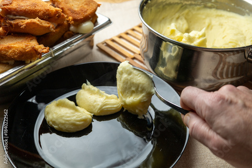 Bilde på lerret Cheese in breadcrumbs with smashed potato