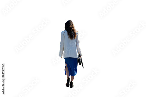 Rear view of a woman in a dress with long dark hair walking away isolated on white background