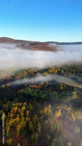 Aerial view of a cloud inversion during sunrise in the cairngorms of scotland