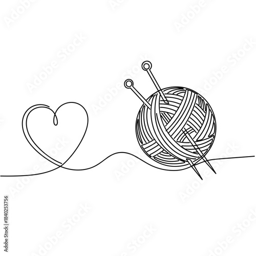 Knitting yarn ball with needles and heart shape outline  