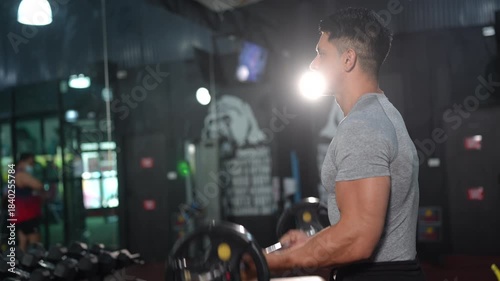 strong athlete man person exercising in the sport gym, workout exercise training in fitness for body strong and fit, bodybuilding and healthy lifestyle people