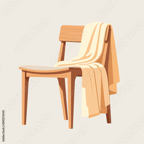 Stylish wooden chair with a cozy cream-colored blanket draped over the backrest for modern home