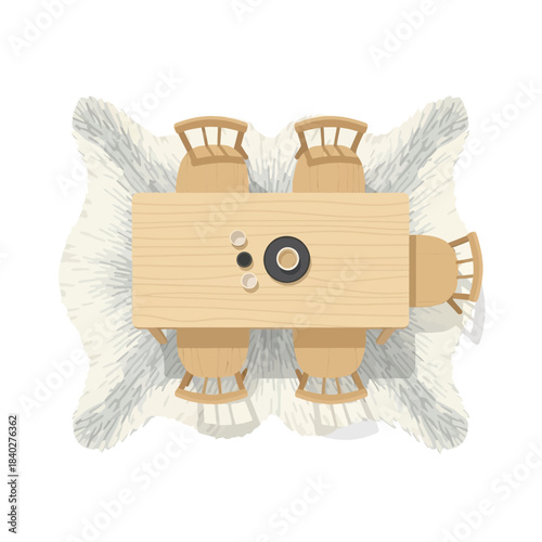 Top-down view of a wooden dining table set with four chairs and decorative elements on a white