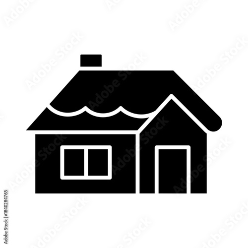 Snowy cabin in forest