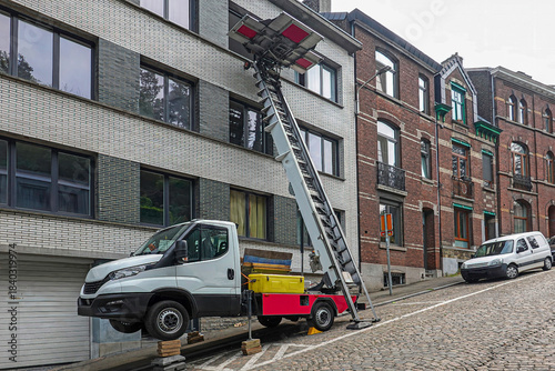 Furniture lift truck on cobblestone street