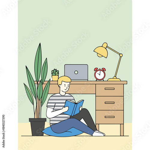 Young Man Reads Book Sitting On Floor Next To Desk With Laptop Plant And Desk Lamp In Light Green Room With Yellow Floor