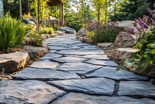 Stone path winding through a residential garden landscape