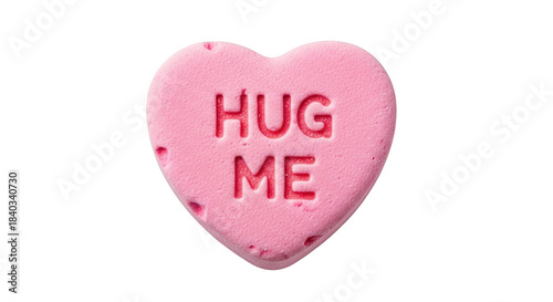 Pink heart candy with hug me text on black background