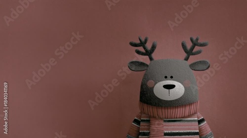 Weihnachtshintergrund - Rentier, das winkt