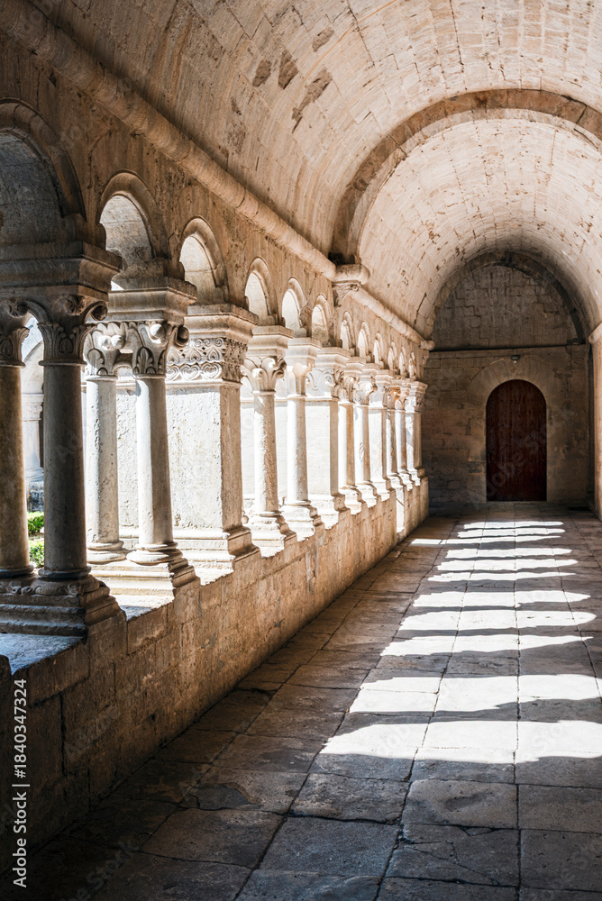 Naklejka premium Abbey of Notre-Dame de Sénanque in Provence, France, corridors of the cloister illuminated by late morning light