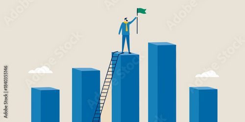 A businessman reaches the top of a bar graph planting a flag