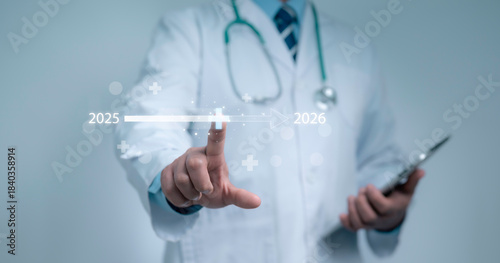 Doctor touching a digital timeline from 2025 to 2026 symbolizes future healthcare innovation and medical technology progress with concepts of digital transformation and modern clinical advancement