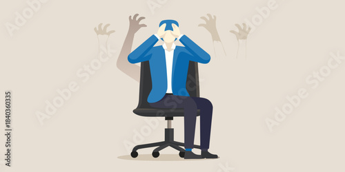 Overwhelmed businessman sitting in office chair with hands covering face