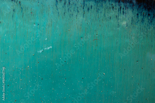 Obraz na plátne Abstract glaze texture in a bright turquoise hue, with dark color streaks flowing down from the top